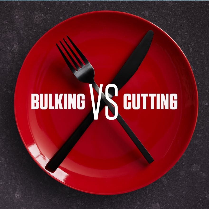 The words 'Bulking VS Cutting' overlaying a red plate with a knife and fork on it.