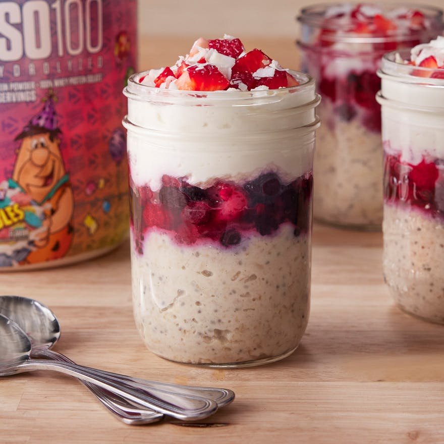 Maria’s Protein Overnight Oats with a tub of Dymatize ISO100 Pebbles Birthday Cake Protein Powder