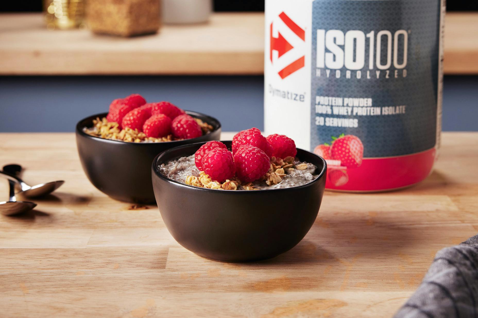 Berry High Protein & Fiber Chia Yogurt Bowls with a tub of Dymatize ISO100 Strawberry Protein Powder