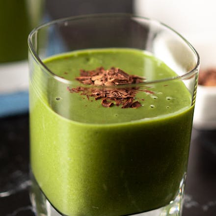 A glass full of Vegan Mint Chocolate Protein Shake